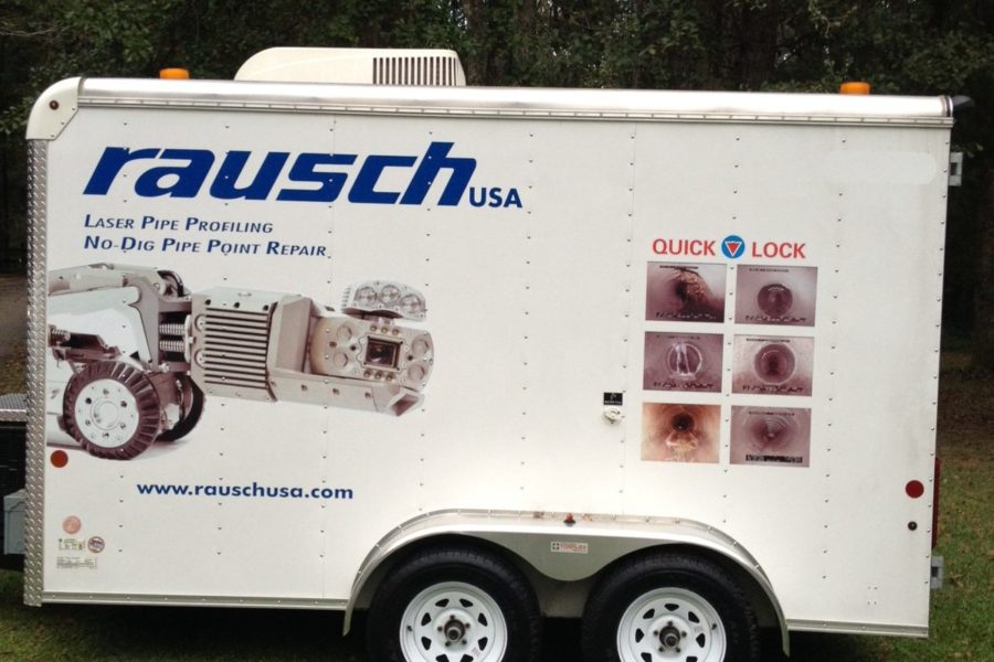 Side view of a white Rausch USA truck